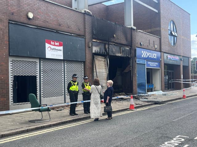 A fire-damaged Citizen’s Advice Bureau office - gutted with soot on the shopfront