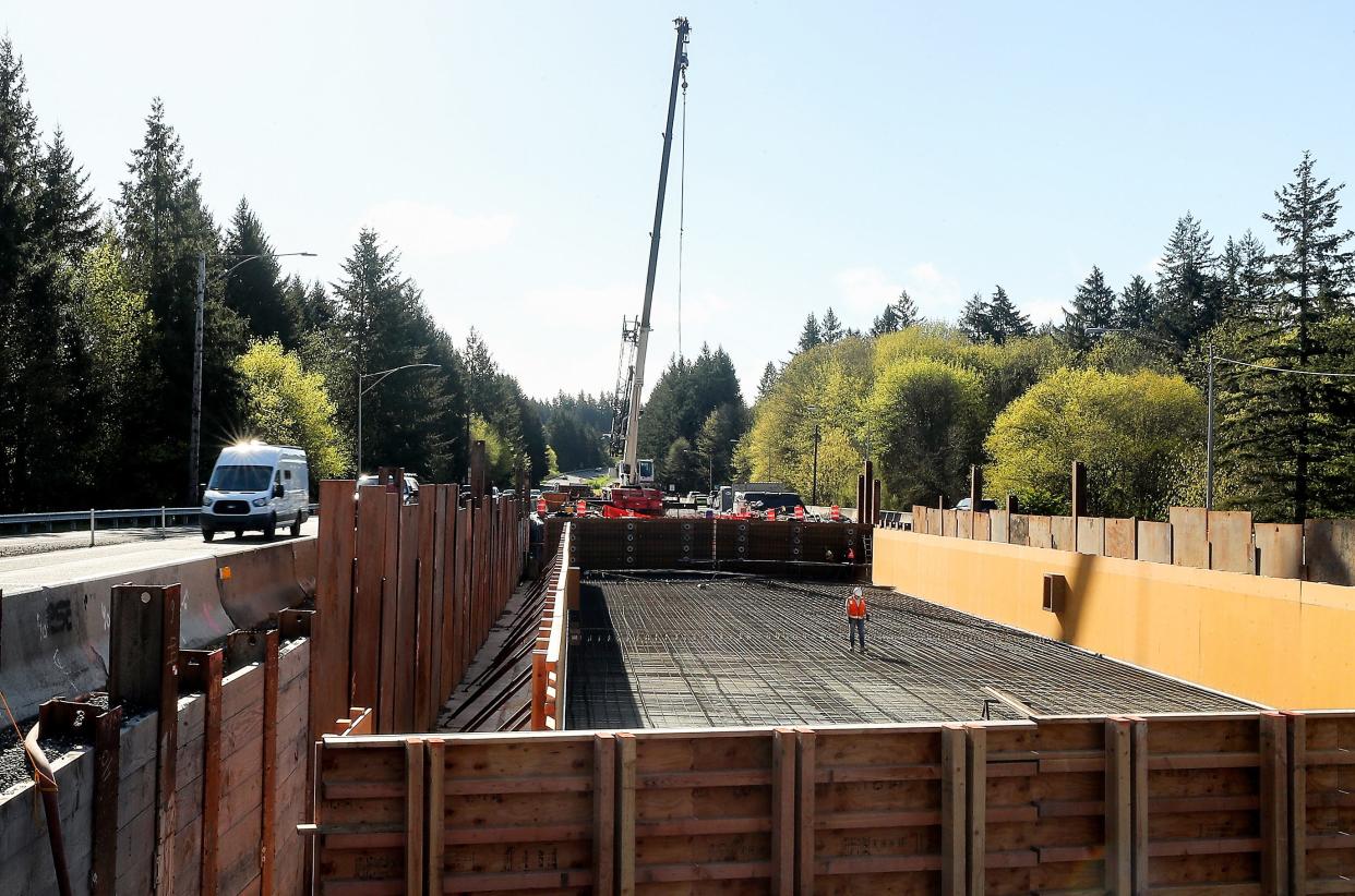FILE — Construction workers move among the rebar that forms the beginning of the new bridge on Highway 3 near the Chico Way interchange on April 8. This portion of the bridge is now ready for vehicles.