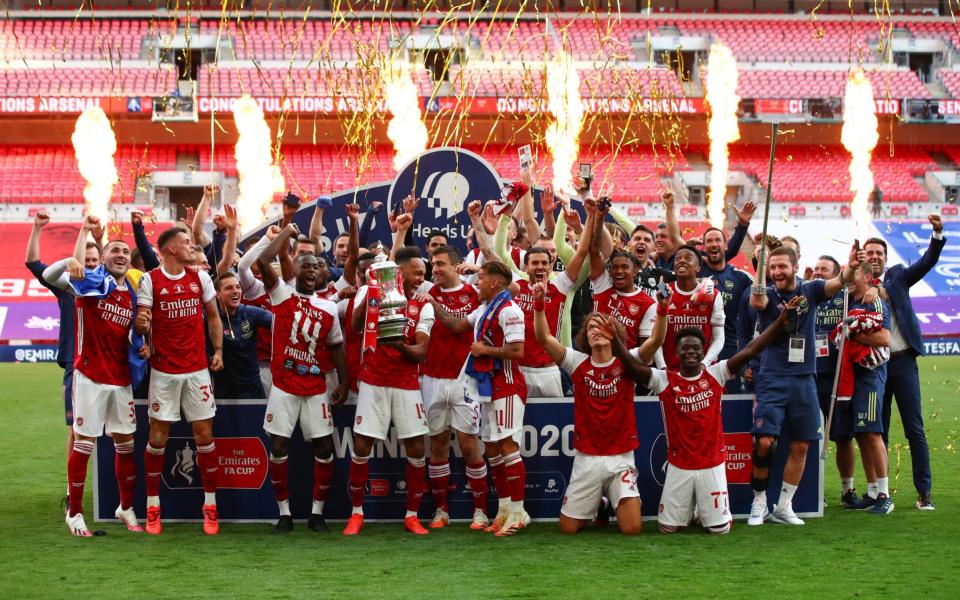 Arsenal players celebrate with the trophy during the FA Cup Final match between Arsenal and Chelsea  - Getty Images