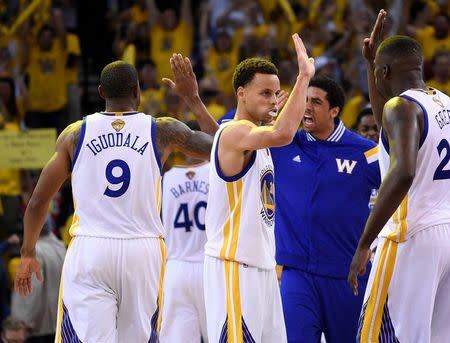 Golden State Warriors guard Stephen Curry (30) celebrates a scoring play during a time out against the Cleveland Cavaliers in the overtime period in game one of the NBA Finals. at Oracle Arena. Mandatory Credit: Kyle Terada-USA TODAY Sports