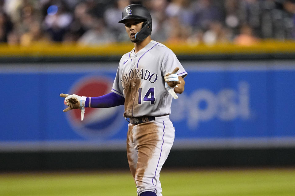 Colorado Rockies' Ezequiel Tovar celebrates after stealing second against the Arizona Diamondbacks during the third inning of a baseball game, Tuesday, Sept. 5, 2023, in Phoenix. (AP Photo/Matt York)