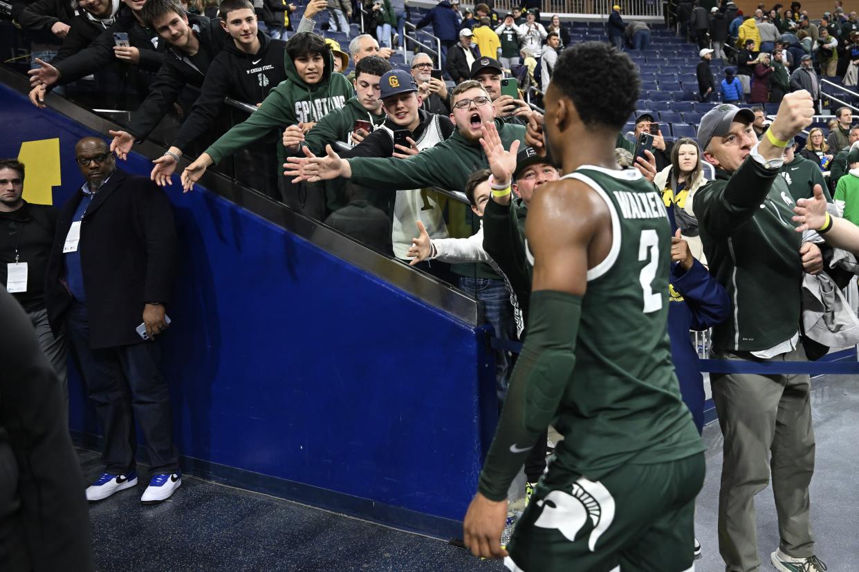 Tyson Walker of the Michigan State Spartans walks off the court after defeating the Michigan Wolverines at Crisler Center in Ann Arbor on Saturday, Feb. 17, 2024.