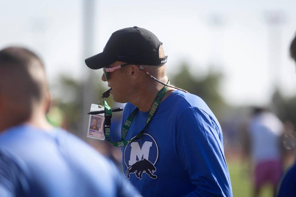 Freshman football coach Clif White blows a whistle to start a drill during football camp at Midlothian High School on Thursday, July 28, 2022. White will miss his first official freshman football practice in 8 years because of his third round of chemotherapy to combat urachal cancer.