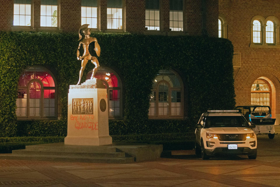 A USC Department of Public Safety vehicle sits next to the base of the Tommy Trojan statue (Jason Goode / AFP via Getty Images)