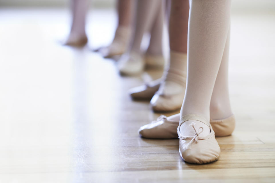 Childrens' feet in a ballet class