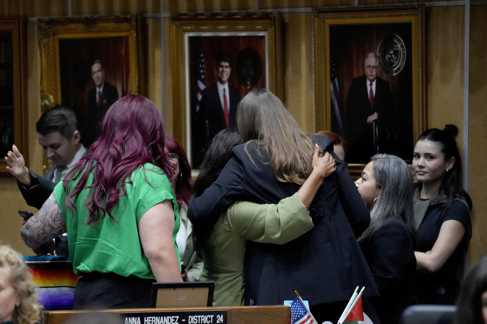 Democratic Arizona state senators hug after a their vote, Wednesday, May 1, 2024, at the Capitol in Phoenix. (AP Photo/Matt York)