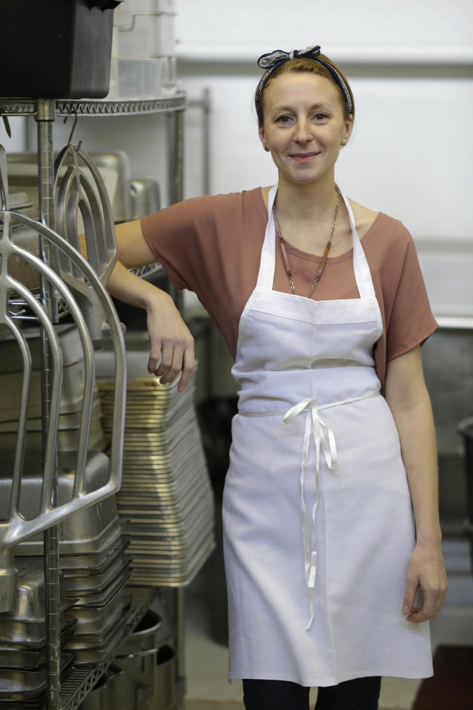 In this Thursday, Feb. 21, 2013 photo, Christina Tosi, pastry chef and founder of Momofuku Milk Bar, poses for a picture at the Milk Bar kitchen in New York. Cereal is going out of the box. Milk, ice cream, muffin mix and more are being infused with the flavor of the classic childhood treat. (AP Photo/Seth Wenig)