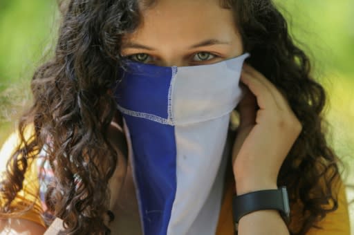 A masked Nicaraguan student protests against the government of President Daniel Ortega in Managua on March 1, 2019