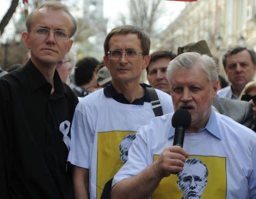 Oleg Shein (L) stands next to Just Russia party leader, Sergei Mironov (R) during a rally in the southern Russian city of Astrakhan