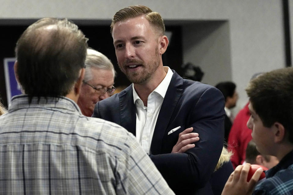 FILE - Ryan Walters, Republican candidate for state superintendent of public instruction, talks with supporters at a Republican watch party Nov. 8, 2022, in Oklahoma City. Walters is a strong supporter of a voucher-style plan that would allow parents to use taxpayer money to homeschool their children or send them to private schools, even religious ones. (AP Photo/Sue Ogrocki, File)