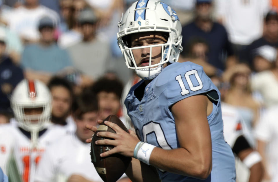 FILE - North Carolina quarterback Drake Maye (10) looks to pass against Syracuse during the first half of an NCAA college football game Saturday, Oct. 7, 2023, in Chapel Hill, N.C. Maye is hoping to continue the trend of homegrown quarterbacks leading their teams to an ACC Championship. (AP Photo/Chris Seward, File)