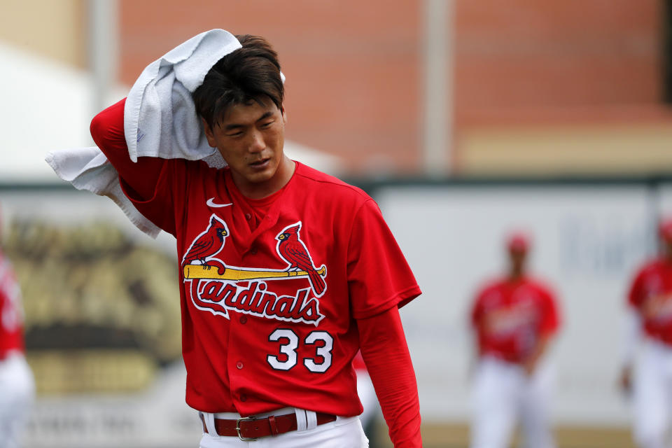 St. Louis Cardinals pitcher Kwang-Hyun Kim heads to the dugout after warming up before the start of a spring training baseball game against the Miami Marlins Wednesday, Feb. 26, 2020, in Jupiter, Fla. (AP Photo/Jeff Roberson)