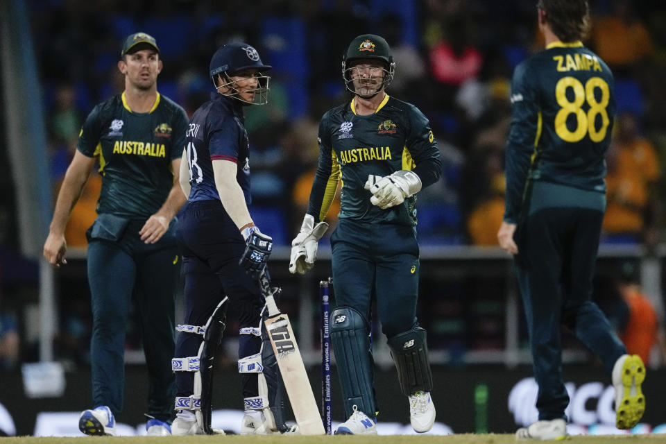 Australia's wicket keeper Matthew Wade, second from right, celebrates the wicket of Namibia's Zane Green, center left, who was trapped LBW, during an ICC Men's T20 World Cup cricket match at Sir Vivian Richards Stadium in North Sound, Antigua and Barbuda, Tuesday, June 11, 2024. (AP Photo/Ricardo Mazalan)