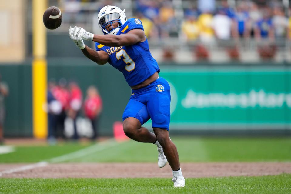 South Dakota State running back Amar Johnson reaches for an incomplete pass during the first half of an NCAA college football game against Drake, Saturday, Sept. 16, 2023, in Minneapolis. (AP Photo/Abbie Parr)