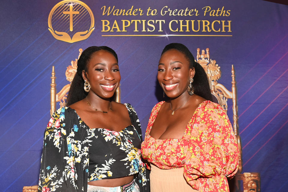 Sisters standing and smiling