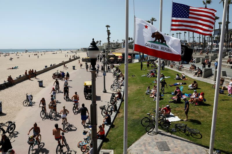 People recreate at the beach on Memorial Day weekend during the outbreak of the coronavirus disease (COVID-19) in Huntington Beach, California