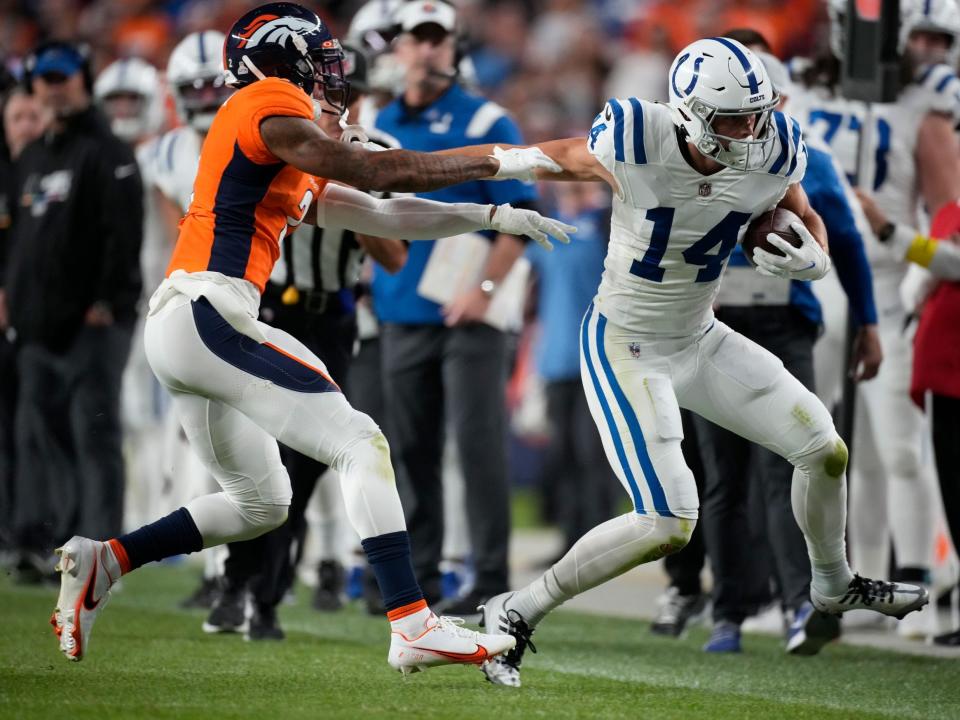 Alec Pierce wards off a defender against the Denver Broncos.