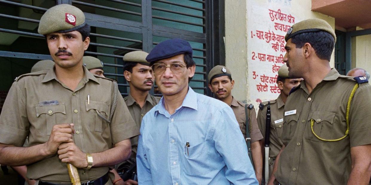 charles sobhraj is escorted by police to a new delhi court on 12 april 1994