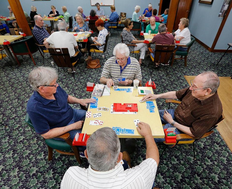 A foursome of players at the Puritan Bridge Club in Braintree, which is celebrating its centennial. Wednesday, June 15, 2022.