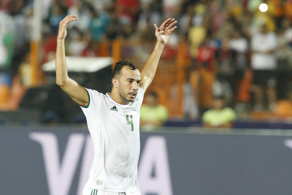 Algeria's Djamel Eddine celebrates after a goal during the African Cup of Nations semifinal soccer match between Algeria and Nigeria in Cairo International stadium in Cairo, Egypt, Sunday, July 14, 2019. (AP Photo/Ariel Schalit)