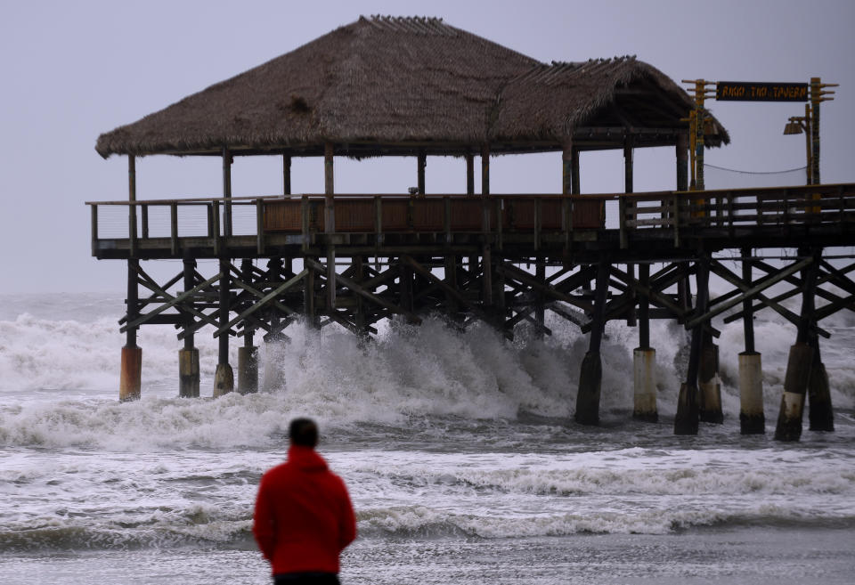 A man watches as strong waves crash into the Cocoa Beach Pier as Hurricane Dorian turns to the north off the eastern coast of Florida after a weakened Category 2 storm  devastates parts of the Bahamas. (Photo: Paul Hennessy/SOPA Images/LightRocket via Getty Images)