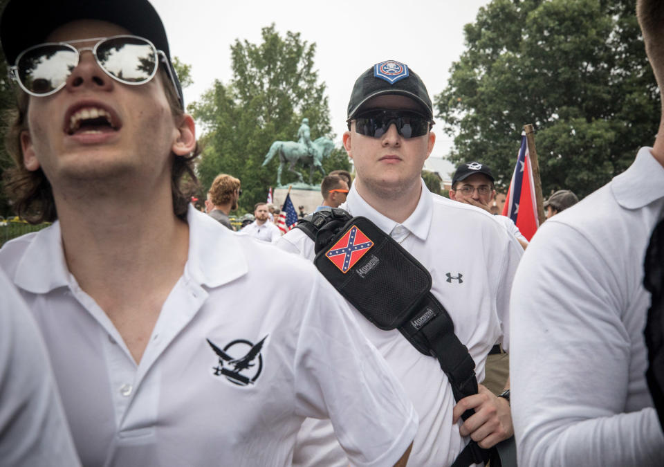 A white supremacist marches in Charlottesville, Virginia, on August 12, 2017, wearing Under Armour. (Photo by Evelyn Hockstein via Getty Images)