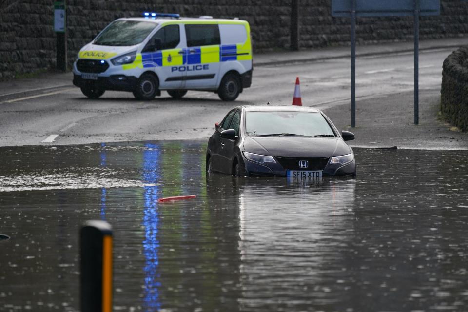 A stranded vehicle in flood water in Belper, Derbyshire as Britons have been warned to brace for strengthening winds and lashing rain as Storm Franklin moved in overnight, just days after Storm Eunice destroyed buildings and left 1.4 million homes without power. Picture date: Monday February 21, 2022.