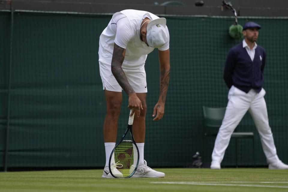 Australia's Nick Kyrgios reacts after losing a point to Greece's Stefanos Tsitsipas during a third round men's singles match on day six of the Wimbledon tennis championships in London, Saturday, July 2, 2022. (AP Photo/Kirsty Wigglesworth)