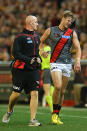 Michael Hurley of the Bombers comes from the ground after rolling his ankle.