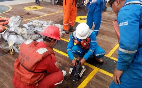 Items believed to be from the wreckage of the Lion Air flight - Credit: AFP