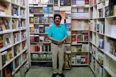 Sattar Muhsin Ali, 60, a stationary store owner, poses for a photograph in Baghdad, Iraq, May 14, 2017. REUTERS/Thaier Al-Sudani