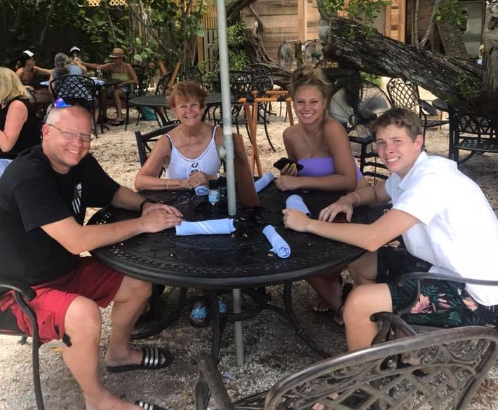 Photo of Wade, Lynn and her grandchildren, Jonathan and Jensen. 