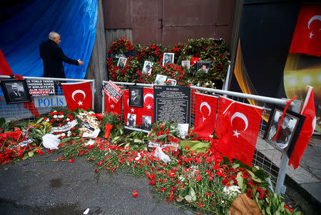 FILE PHOTO: Flowers and pictures of victims are placed near the entrance of Reina nightclub in Istanbul, Turkey, January 17, 2017. REUTERS/Osman Orsal/File Photo