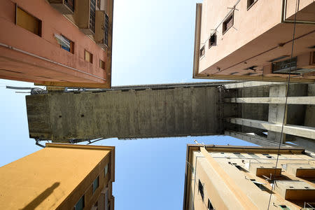 FILE PHOTO: A section of the collapsed Morandi Bridge is seen above, from the "red zone" restricted area in Genoa, Italy August 17, 2018. To match Insight ITALY-MOTORWAY/COLLAPSE-SAFETY. REUTERS/Massimo Pinca/File Photo