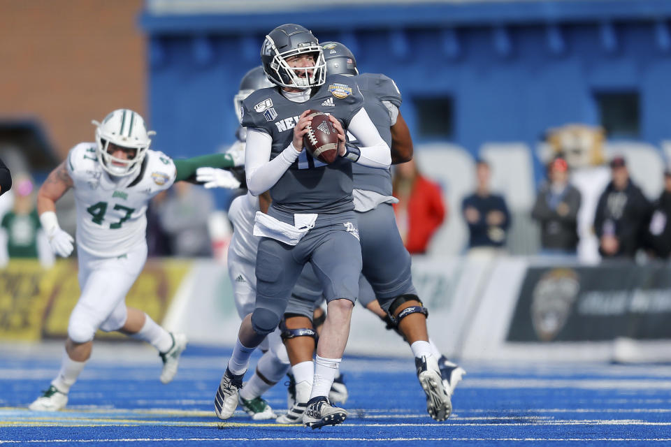 Nevada quarterback Carson Strong (12) moves up in the pocket looking downfield against Ohio in the first half of the Famous Idaho Potato Bowl an NCAA college football game Friday, Jan. 3, 2020, in Boise, Idaho. (AP Photo/Steve Conner)