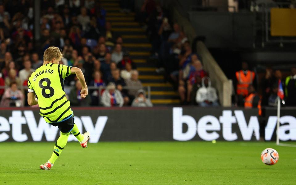 Arsenal's Martin Odegaard scores their first goal from the penalty spot