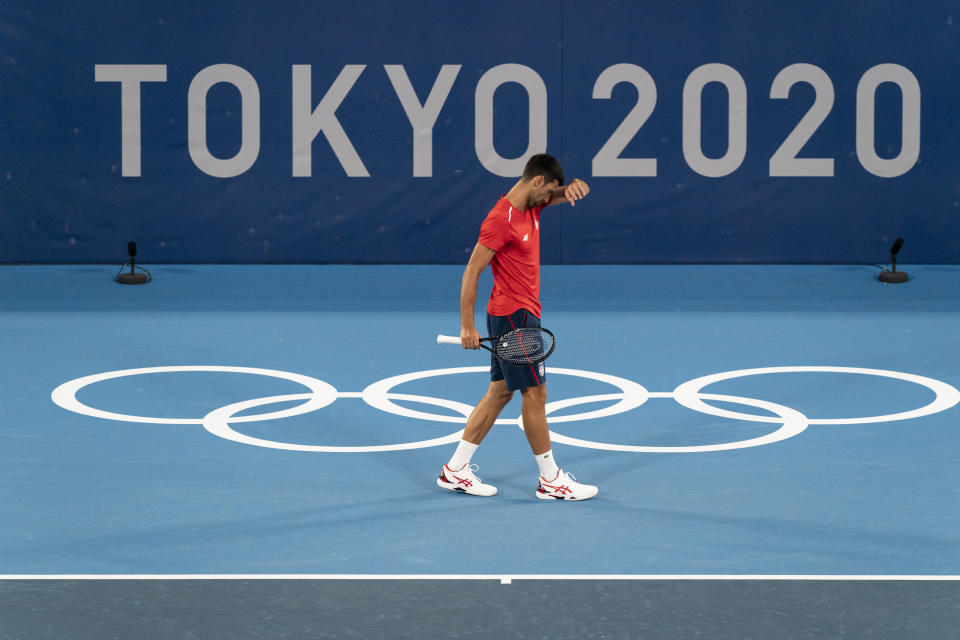 Novak Djokovic, of Serbia, practices at the Ariake Tennis Center ahead of the 2020 Summer Olympics, Wednesday, July 21, 2021, in Tokyo, Japan. (AP Photo/Alex Brandon)