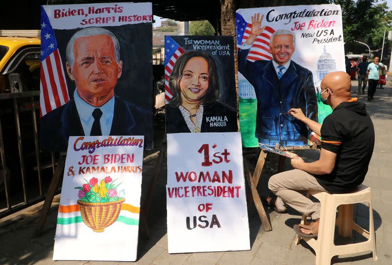 Artist applies finishing touches to painting of U.S. President-elect Joe Biden, in Mumbai