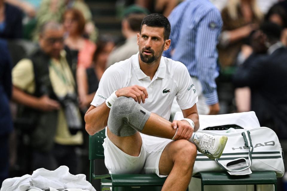 Novak Djokovic was sporting a grey compression sleeve on his right knee (AFP via Getty Images)