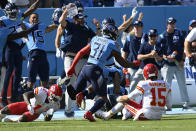 Kansas City Chiefs quarterback Patrick Mahomes (15) watches as his fumble is recovered by the Tennessee Titans in the first half of an NFL football game Sunday, Oct. 24, 2021, in Nashville, Tenn. Titans free safety Kevin Byard (31) caused the fumble. (AP Photo/Mark Zaleski)