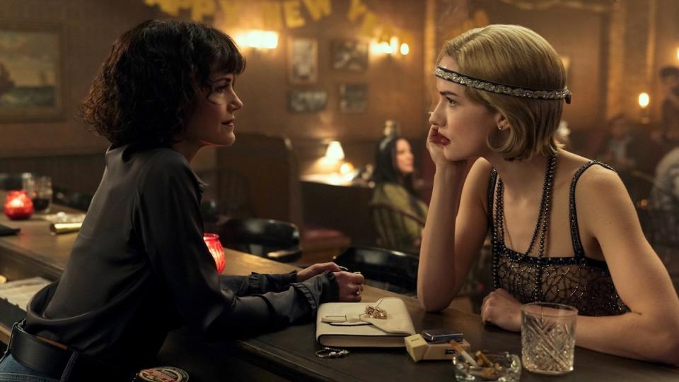 Verna behind a bar talks to Madeline dresses as Daisy fronm The Great Gatsby on The Fall of the House of Usher