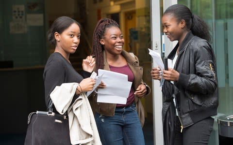 Students celebrate their A level results at City and Islington College, London - Credit:  Eddie Mulholland