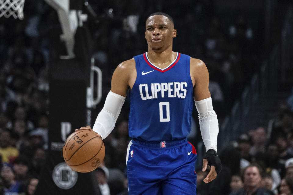 Los Angeles Clippers guard Russell Westbrook (0) dribbles up the court during the first half of an NBA basketball game against the Indiana Pacers, Monday, March 25, 2024, in Los Angeles. (AP Photo/William Liang)