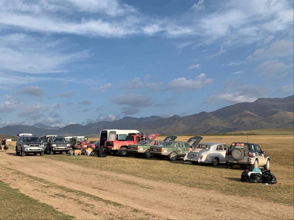 A line of vintage cars in Kyrgyzstan.