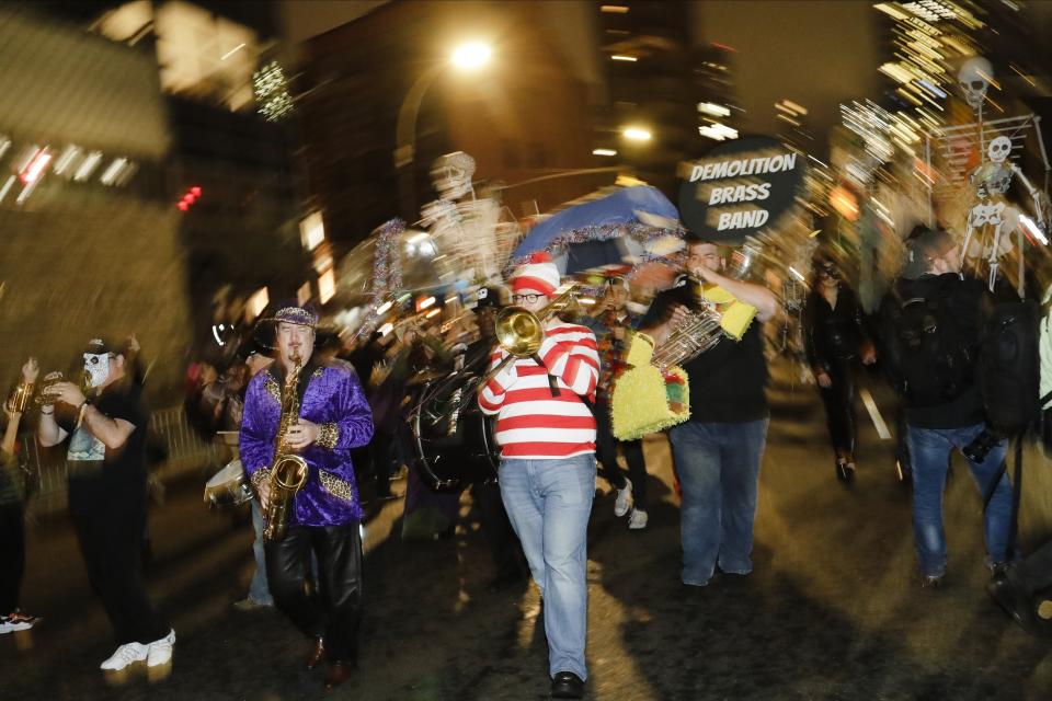 Revelers march during the Greenwich Village Halloween Parade, Thursday, Oct. 31, 2019, in New York. (AP Photo/Frank Franklin II)