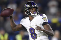 FILE - In this Dec. 22, 2018 file photo, Baltimore Ravens quarterback Lamar Jackson passes against the Los Angeles Chargers during the first half in an NFL football game in Carson, Calif. The Ravens won last year behind the arm, and mostly legs, of rookie quarterback Lamar Jackson. (AP Photo/Kelvin Kuo, File)