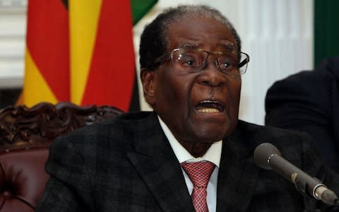 Zimbabwean President Robert Mugabe delivers his speech during a live broadcast at State House in Harare - Credit: AP