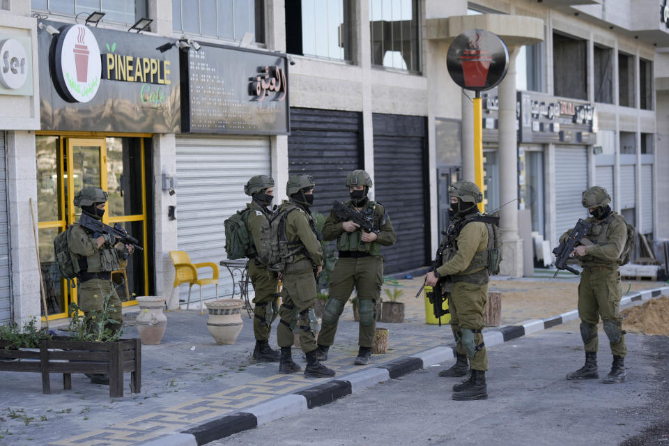 Israeli soldiers operate in village of Sarra near the Palestinians West Bank city of Nablus, Sunday, March 12, 2023. Israeli forces fatally shot three Palestinian gunmen who opened fire on troops in the occupied West Bank. It was the latest bloodshed in a year-long wave of violence in the region. (AP Photo/Majdi Mohammed)