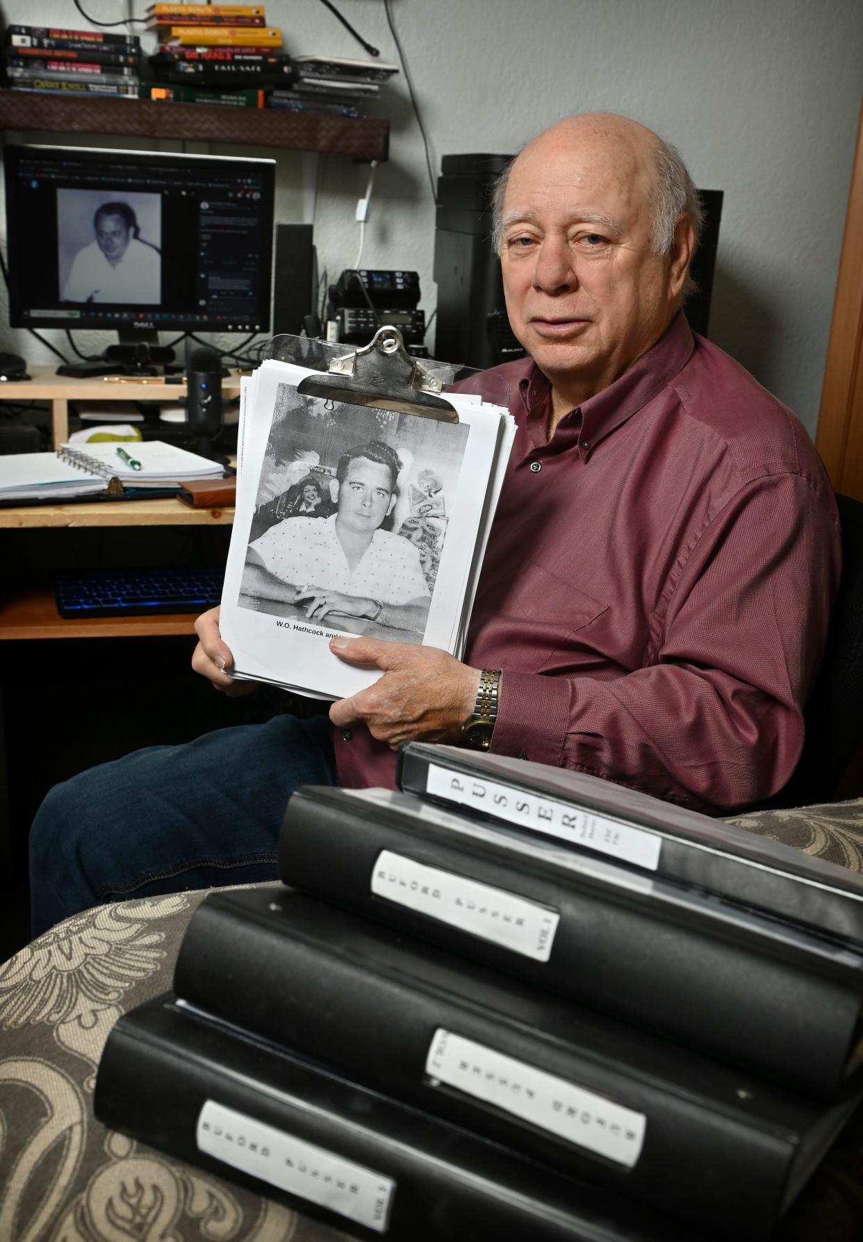 Mike Elam, a retired sheriff from Bella Vista, Arkansas, shows a picture of W.O. (William Odel) Hathcock, owner of The Plantation Club – part of the research he accumulated for his self-published book about investigating the legend of Buford Pusser – at his home. Elam says he has provided tips to the Tennessee Bureau of Investigations, which recently exhumed the body of Pusser's wife.
