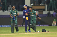 Indian cricket captain Virat Kohli congratulates Pakistan's Mohammad Rizwan at the end of the Cricket Twenty20 World Cup match between India and Pakistan in Dubai, UAE, Sunday, Oct. 24, 2021. (AP Photo/Aijaz Rahi)